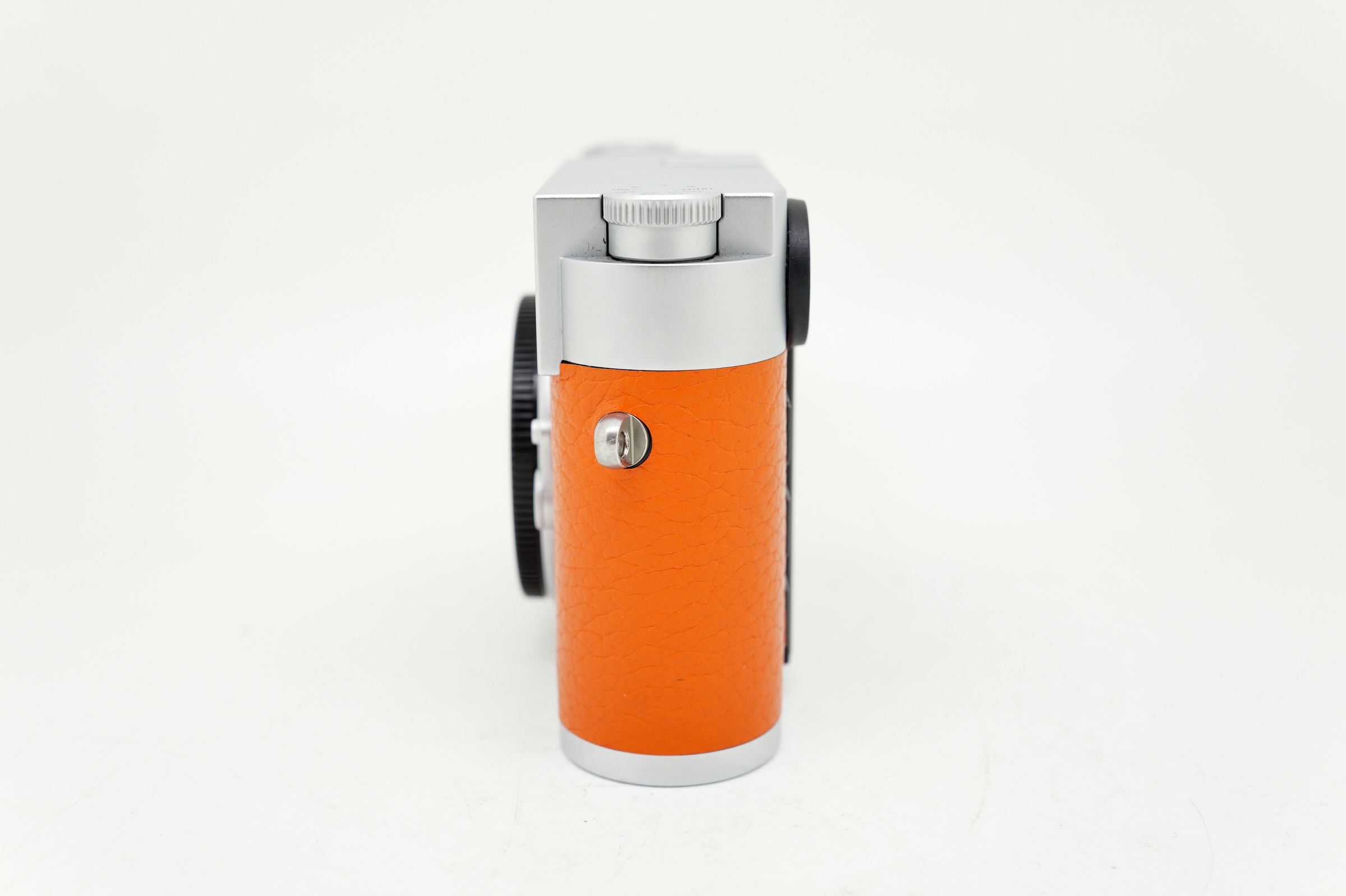 Leica M11 Silver on orange Leatherette