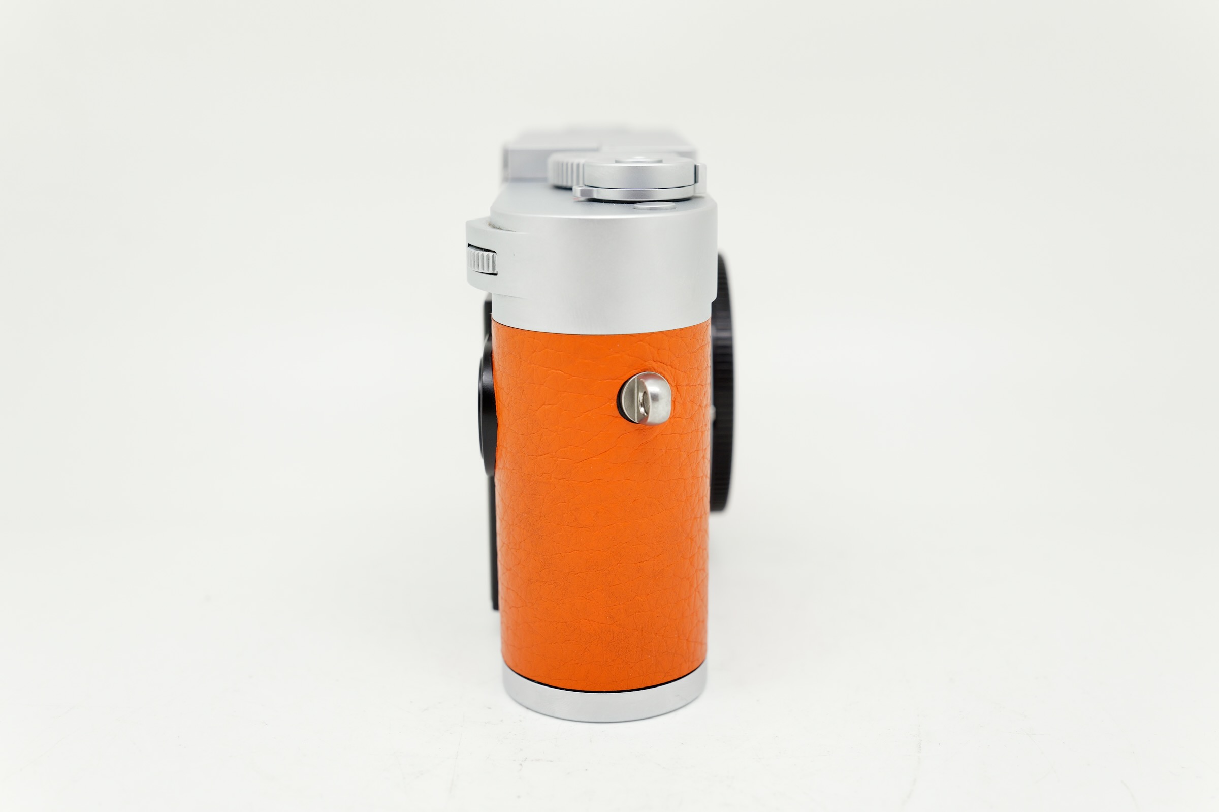 Leica M11 Silver on orange Leatherette