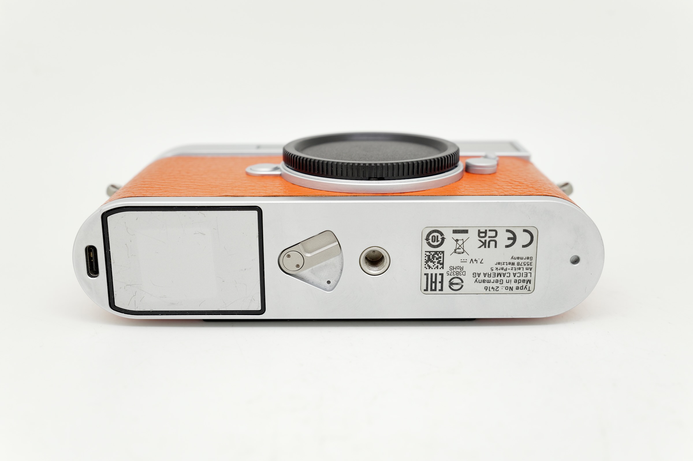 Leica M11 Silver on orange Leatherette
